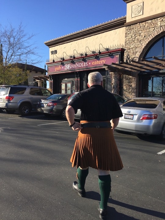Bruce Locken in kilt outside 36 Handles pub and eatery